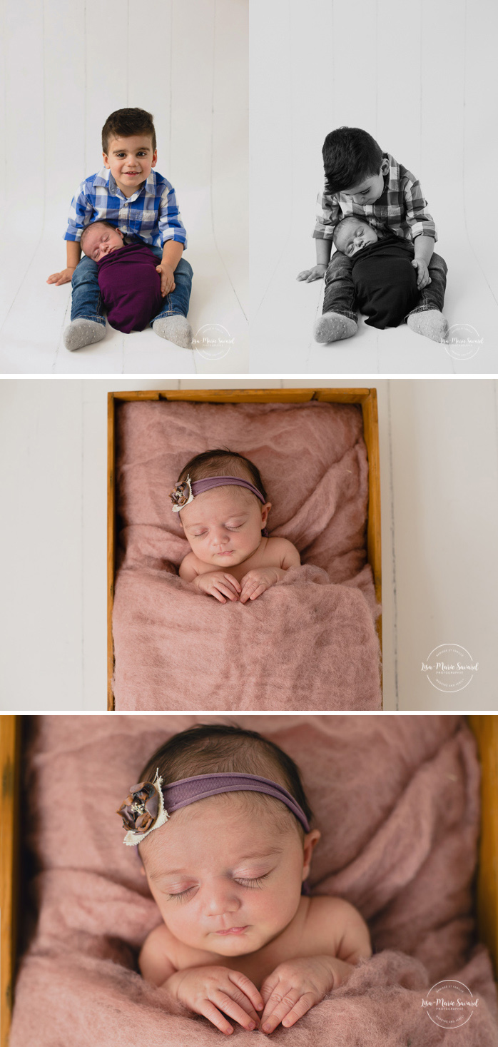 Newborn photo with sibling. Big brother with newborn sister. Sibling holding newborn baby in their arms. Big brother holding newborn sister in his arms. Newborn sleeping in wood crate with wool fluff. Newborn baby girl. Newborn session ideas. Simple clean minimalist newborn photos. Organic neutral newborn photos. Baby girl organic floral tie back headband. Photographe de nouveau-né à Montréal. Séance photo nouveau-né en studio à Montréal. Montreal newborn photographer. In-studio newborn session Montreal | Lisa-Marie Savard Photographie | Montréal, Québec | www.lisamariesavard.com