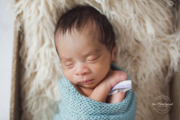 Preemie newborn photos. NICU newborn session. Mixed baby photos. Wrapped baby with hospital bracelet.