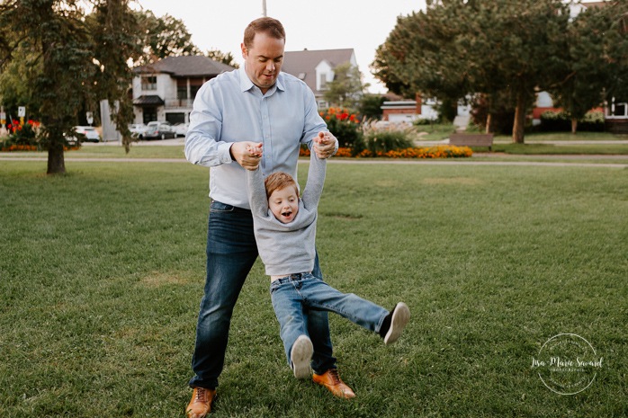 Dad playing with son. Father and son photos. Outdoor family session. Outdoor family photos. Family of four photos. Photographe à Dorval. Photographe de famille à Montréal. Montreal West Island family photos. Montreal family photographer.