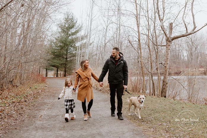 Family photos with dog. Family session with dog. Family walking hand in hand together. Parents swinging child. Maternity photos with child. Maternity photos with sibling. Photos de maternité dans le Sud-Ouest. Photographe de maternité à Ville-Émard. Montreal Southwest maternity photos.