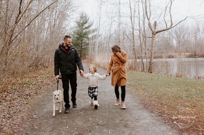 Family photos with dog. Family session with dog. Family walking hand in hand together. Parents swinging child. Maternity photos with child. Maternity photos with sibling. Photographe à Ville-Émard. Montreal Southwest maternity photos.