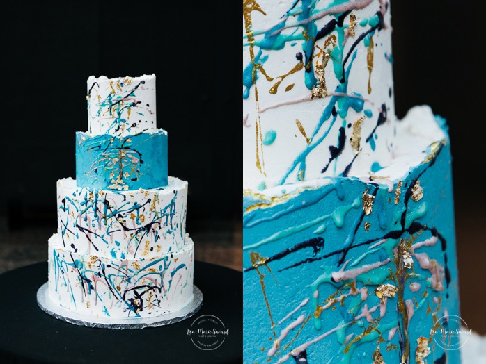 Jackson Pollock wedding cake. Paint splash wedding cake. White, turquoise, purple and gold wedding cake. Mariage au Musée de la Civilisation Québec Mariage dans le Vieux-Québec. Photographe mariage Québec. Old Quebec wedding photos.
