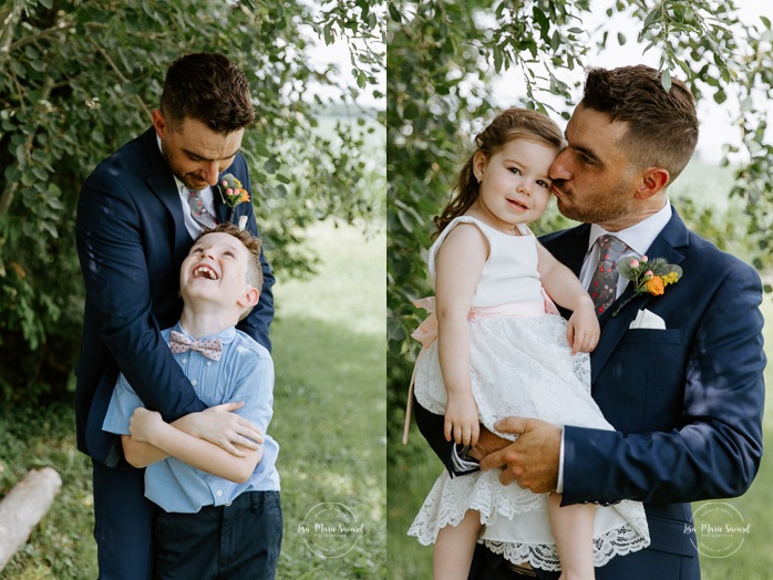 Groom with children. Groom with son and daughter. Photographe de mariage à Saint-Hyacinthe. Photographe St-Hyacinthe. Photos de mariage au Jardin Daniel A. Séguin.