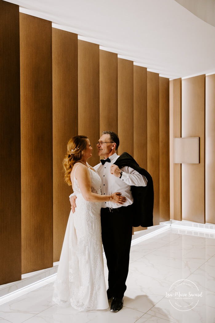 Wedding photos in dark hotel lobby. Older couple wedding photos. Middle aged couple wedding photos. Retired couple wedding photos. Mature couple wedding photos. Photographe de mariage à Laval. Laval wedding photographer.