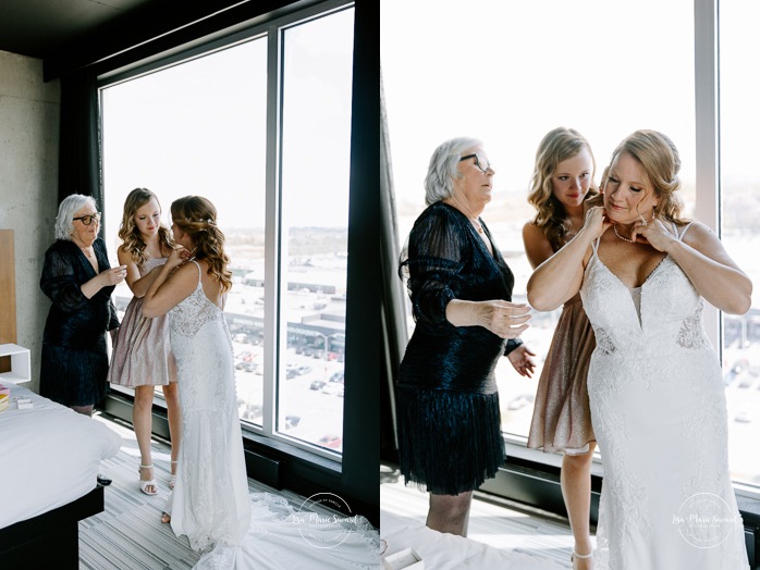 Bride getting ready with mother and daughter in hotel room. Mariage Grand Times Hotel Laval. Mariage à Laval. Laval Grand Times Hotel wedding. Laval wedding photographer.