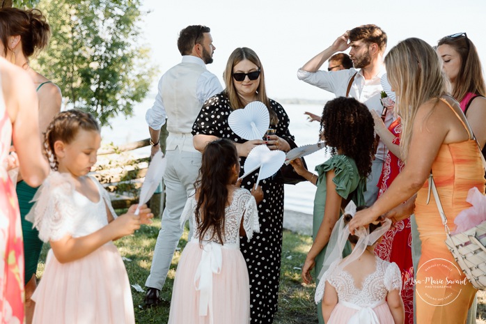 Outdoor wedding ceremony in front of windmill. Mariage à la Pointe-du-Moulin. Photographe mariage à Montréal. Pointe-du-Moulin wedding. Montreal wedding photographer.