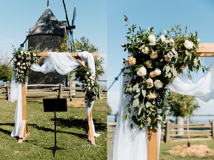 Outdoor wedding ceremony in front of windmill. Mariage à la Pointe-du-Moulin. Photographe mariage à Montréal. Pointe-du-Moulin wedding. Montreal wedding photographer.