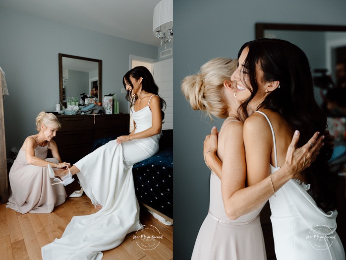 Bride getting ready with bridesmaids at home. Mariage à Chicoutimi. Photographe mariage Saguenay-Lac-Saint-Jean.