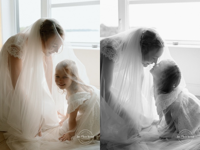 Bride and daughter under veil. Bride and daughter wedding photos. Mariage au bord du Lac-Saint-Jean. Auberge des Îles. Photographe mariage Saguenay-Lac-Saint-Jean