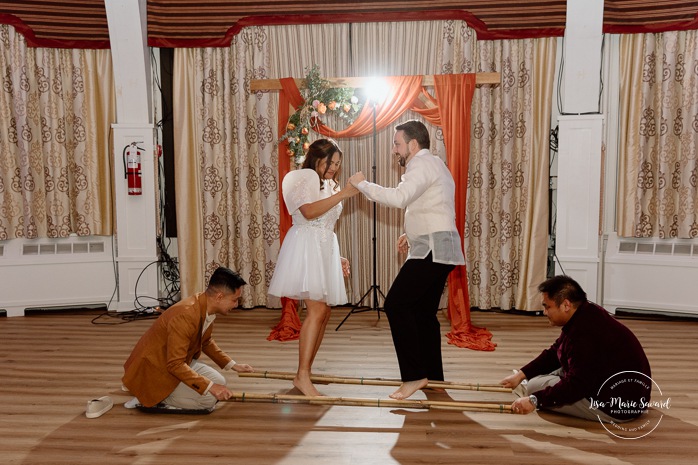 Traditional Filipino wedding dance. Multicultural wedding reception. Mixed wedding reception. Mariage au Manoir du lac Delage. Photographe de mariage Ville de Québec. Quebec City wedding photographer. Manoir du lac Delage wedding.